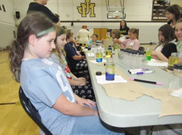 Fifth Grade Girls Conduct Science Experiments During STEM Day